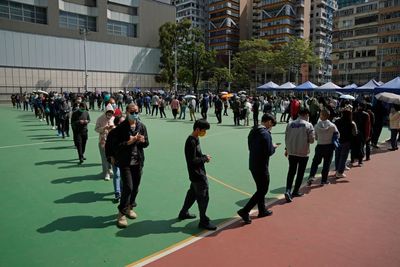 Hong Kong reports record COVID-19 cases, tightens measures