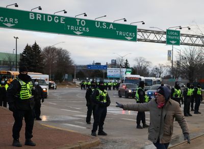 Latest Canada updates: Police clear protesters occupying bridge