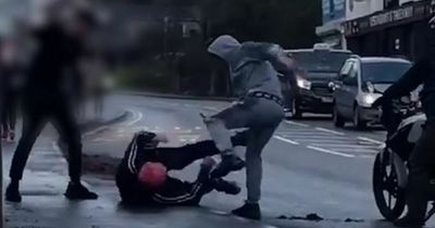 Armed men caught on camera fighting in street in middle of afternoon