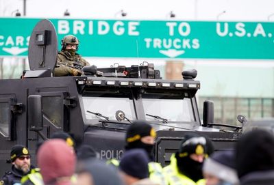 Police positioned to clear key border bridge of protesters in Canada: AFP journalist