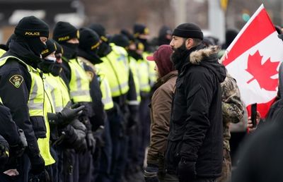 Canadian police evacuate key border bridge as Ottawa protest again grows