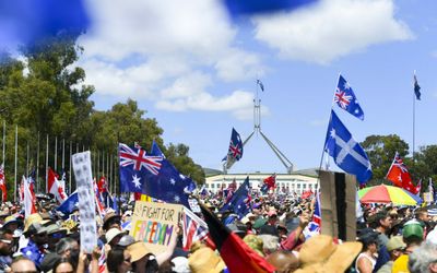 Federal government relaxes aged care COVID rule as protesters converge on Canberra