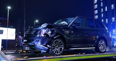 Busy road closed after Range Rover and Mercedes involved in crash near city centre