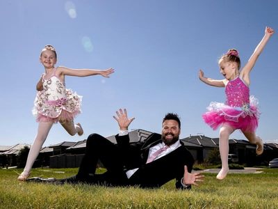 Fathers leap into daddy-daughter ballet