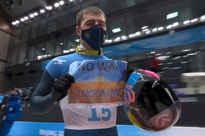 Ukraine Olympic team calls for peace, IOC wants no protests