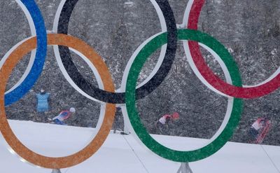 AP PHOTOS: Snow delights — and disrupts — Beijing Olympics