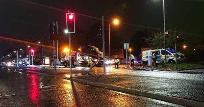 Two people rushed to hospital after smash involving police car and BMW in Glasgow