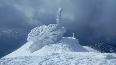 Snow Transforms Mountaintop Watchtower Into Massive Sculpture Resembling Swan On Ice