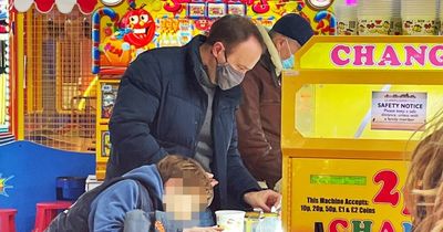 Matt Hancock seen playing 2p slot machine with his children on Welsh pier