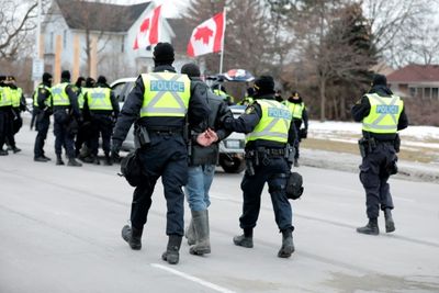 Canada police arrest protesters, mayor says border bridge crisis over