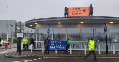 Extinction Rebellion stage protest on roof of HMRC Longbenton