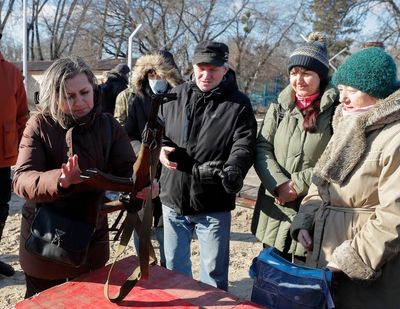 ‘We always knew we would have to fight for ourselves’: Worried Ukrainians prepare for whatever comes next