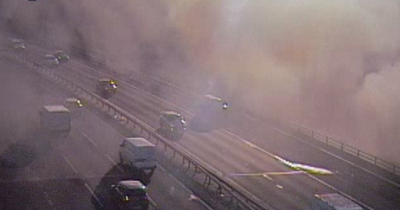 Car blaze sends smoke billowing across M90 as huge tailbacks form