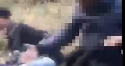 Moment gang of '30 Leeds schoolkids' ambush two girls, beat them up and 'throw them in lake'