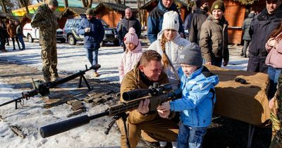 Chilling photos show Ukrainian kids handling guns amid Russian invasion threat
