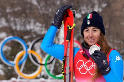 Italy’s Sofia Goggia battles through pain barrier to claim downhill silver