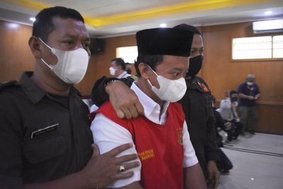 Indonesian principal given life term for raping 13 students