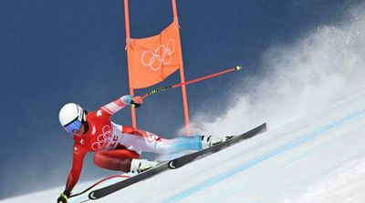 Suter Confirms Swiss Dominance with Olympic Downhill Gold