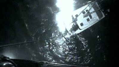 VIDEO: US Coast Guard Saves 2 Boaters And A Dog From Sinking Catamaran