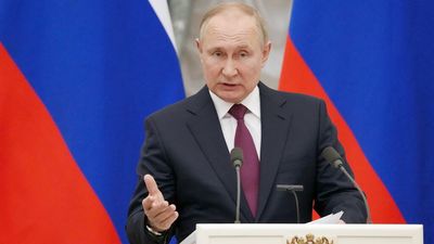 Putin confirms "partial withdrawal" of troops but signals threat not over