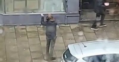 Edinburgh passerby lobs coin to guitarist busking from his first floor window