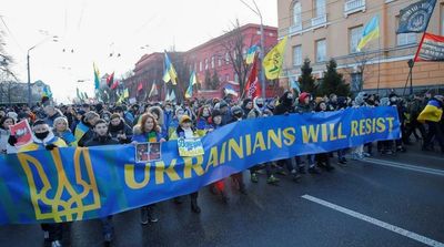 ‘We Fear No One:’ Ukrainians Raise Flags to Defy Russia Invasion Fear
