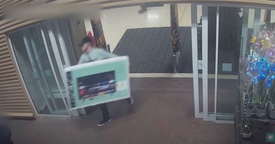 Watch as man casually walks out of Tesco Enniskillen with 50 inch TV without paying