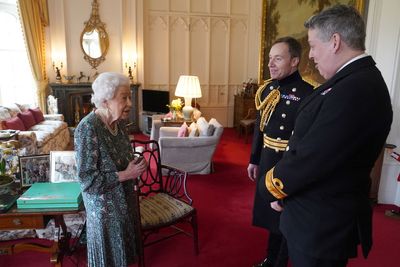 Queen Elizabeth quips she 'can't move' too much