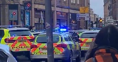 Edinburgh police 'chase' blocks busy city centre street as shoppers watch on
