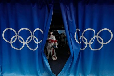 AP PHOTOS: US, Canada hockey lose on Day 12 at Olympics