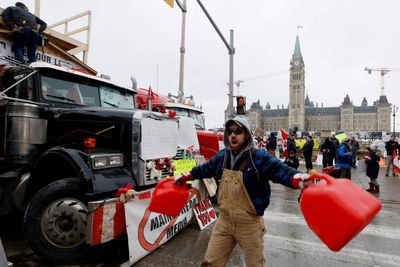 Canada trucker protest - live: Convoy organiser arrested as police take action on defiant Ottawa occupation