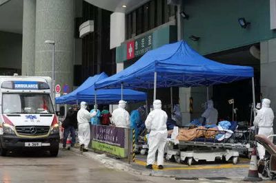 Overflowing Hong Kong hospitals forced to put Covid beds outside