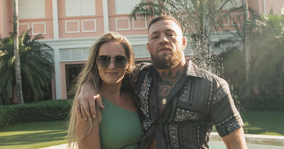 Conor McGregor and partner Dee Devlin can't keep their hands off each other on tropical holiday