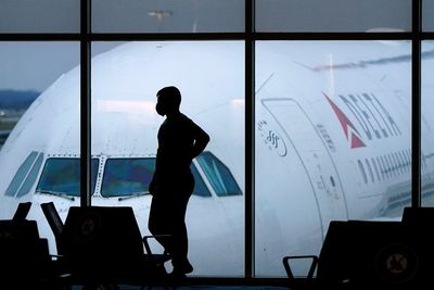 Anti-vaxxer arrested for trying to open plane door so he could spread Covid vaccine misinformation