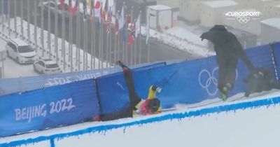 Skier smashes into camera operator in daring halfpipe run at Beijing Winter Olympics