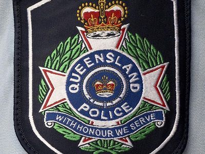 Rescuer swept off Qld beach still missing