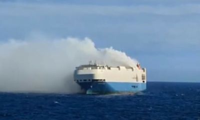 Ship carrying 1,100 Porsches 'burning and adrift'