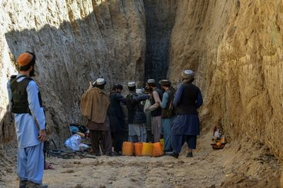 Rescuers near boy trapped in Afghan well, but rock blocks progress