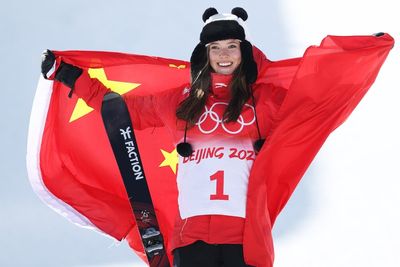 Eileen Gu continues golden run at Winter Olympics but section of home fury takes shine off success