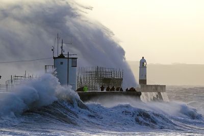 Storm Eunice: People urged to stay at home amid 90mph winds across UK