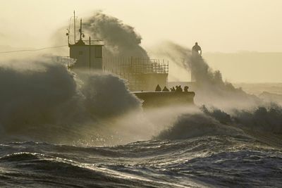 Man killed by falling tree as Storm Eunice brings 100mph winds to UK