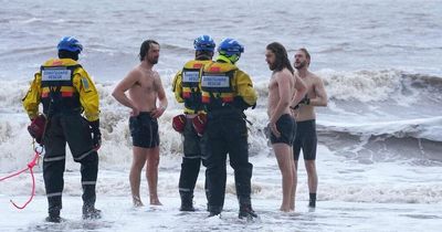 Three defy danger to life warnings to go swimming in sea