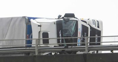 Storm Eunice: Terrifying moment 'red alert' 88mph winds blow over lorries on motorway