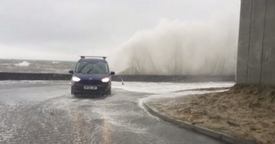 Storm Eunice batters Scots coastline as footage shows huge waves crashing over wall on to cars