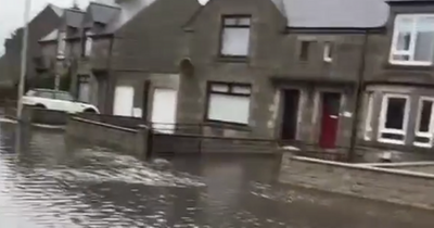 Storm Eunice batters country with heavy rain as Scots street left with major flooding