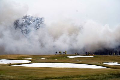 Have investigators determined a cause for the massive Oakland Hills Country Club fire?