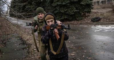 Ukraine officials flee to bomb shelter during shelling attack as invasion fears grow