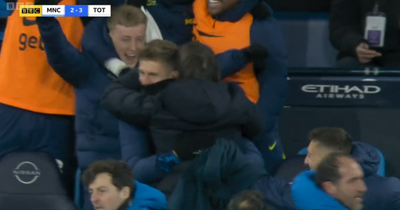 The moment wild Antonio Conte leaps over dugout seats to embrace Tottenham's Joe Rodon in crazy Man City win