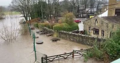 Kirkstall Bridge Inn pub beer garden engulfed by flood as torrential rain batters Leeds