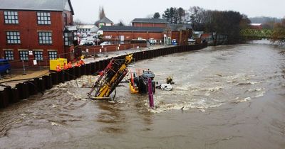 Digger swept away as Storm Franklin bears down causing river to burst banks